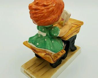 The E. reccomend Goebel redhead figurine
